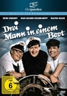 Drei Mann in einem Boot